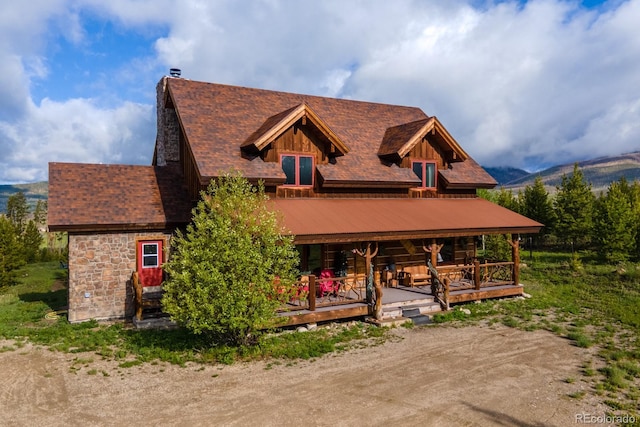 291 County Road 452, Grand Lake, CO 80447 - view of front facade featuring a chimney and a porch