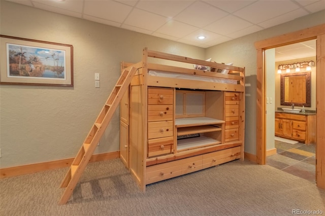 291 County Road 452, Grand Lake, CO 80447 - unfurnished bedroom with a paneled ceiling, carpet, baseboards, a textured wall, and ensuite bath