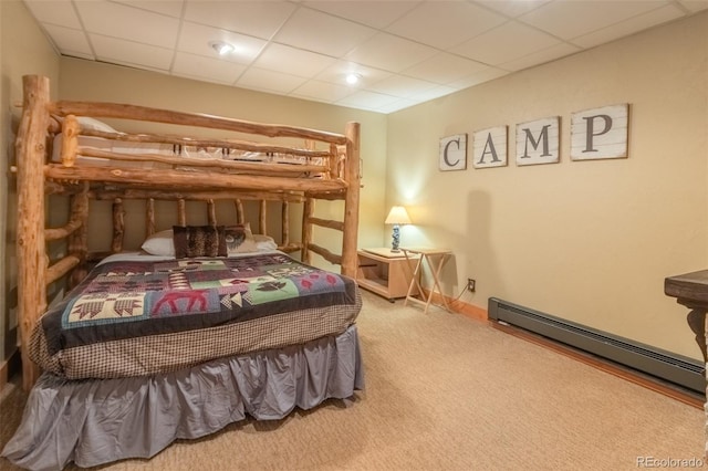 291 County Road 452, Grand Lake, CO 80447 - bedroom featuring a baseboard radiator, carpet flooring, and a drop ceiling