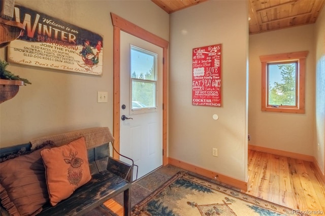 291 County Road 452, Grand Lake, CO 80447 - doorway featuring healthy amount of natural light, wood finished floors, wooden ceiling, and baseboards