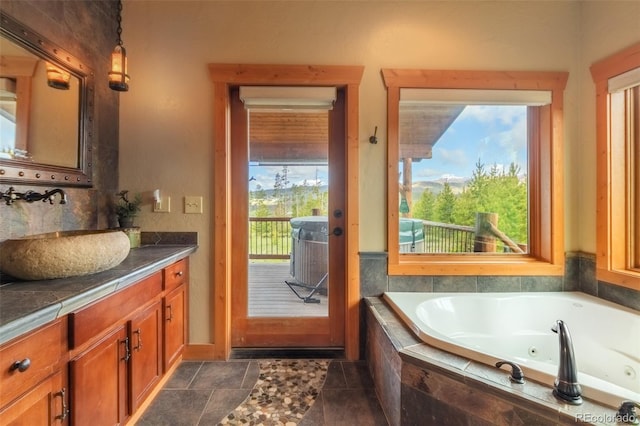 291 County Road 452, Grand Lake, CO 80447 - full bathroom featuring vanity, healthy amount of natural light, and a whirlpool tub
