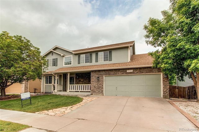 11183 E 114th Ave, Commerce City, CO 80640 - view of front of property with a porch, concrete driveway, roof with shingles, and stone siding