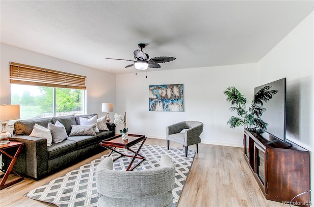 11183 E 114th Ave, Commerce City, CO 80640 - living room with a ceiling fan, light wood-style flooring, and baseboards