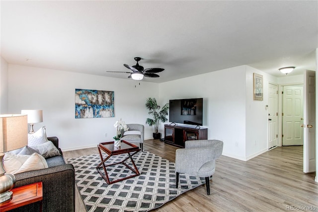 11183 E 114th Ave, Commerce City, CO 80640 - living room with wood finished floors, baseboards, and a ceiling fan