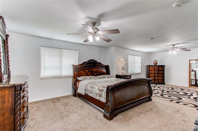 11183 E 114th Ave, Commerce City, CO 80640 - bedroom featuring light colored carpet, baseboards, ceiling fan, and a textured ceiling