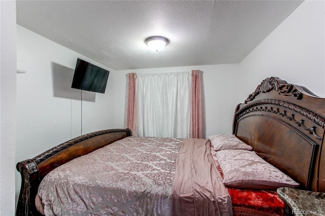 11183 E 114th Ave, Commerce City, CO 80640 - bedroom featuring a textured ceiling