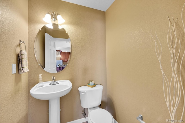 bathroom with sink and toilet