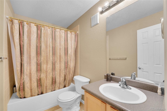 full bathroom with vanity, a textured ceiling, shower / bath combo, and toilet