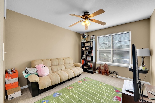 carpeted living room featuring ceiling fan