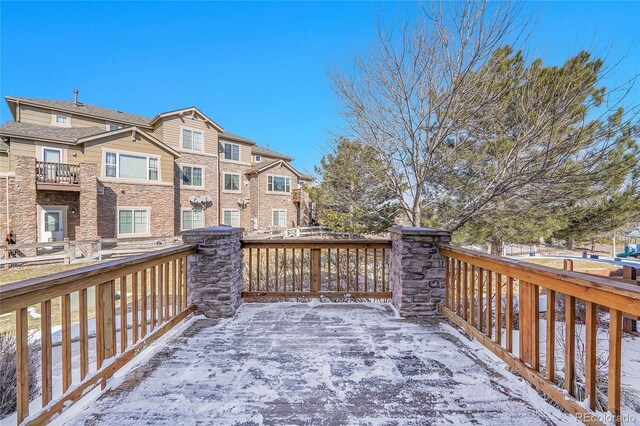 view of snow covered deck