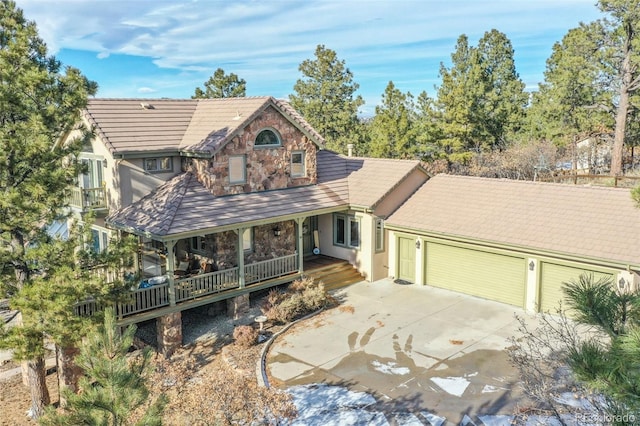 view of front of home featuring a porch and a garage