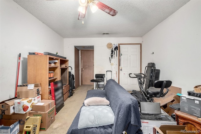 2201 Sable Blvd Unit 1003, Aurora, CO 80011 - workout area with light colored carpet, a textured ceiling, and a ceiling fan