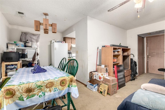 2201 Sable Blvd Unit 1003, Aurora, CO 80011 - dining area featuring carpet, a ceiling fan, and a textured ceiling