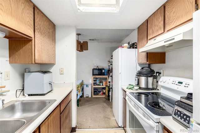 2201 Sable Blvd Unit 1003, Aurora, CO 80011 - kitchen featuring white appliances, a sink, unfinished concrete floors, light countertops, and brown cabinetry