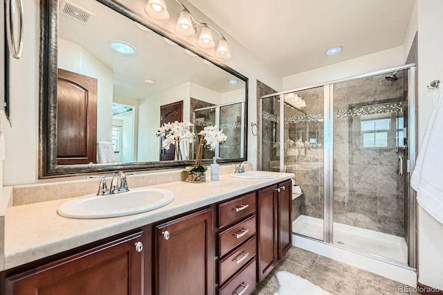 2150 Wagon Way, Louisville, CO 80027 - full bathroom featuring double vanity, a shower stall, tile patterned floors, and recessed lighting