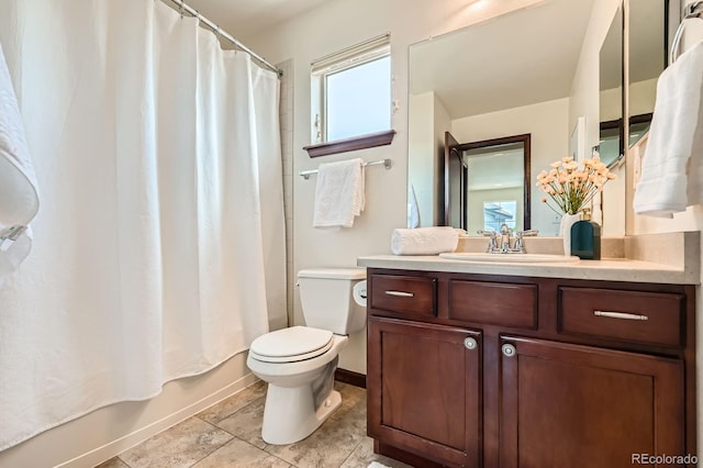 2150 Wagon Way, Louisville, CO 80027 - bathroom with toilet, vanity, shower / bath combination with curtain, baseboards, and tile patterned floors