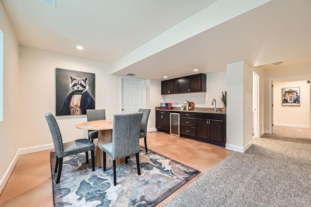 2150 Wagon Way, Louisville, CO 80027 - dining area with beverage cooler, bar with sink, baseboards, and recessed lighting
