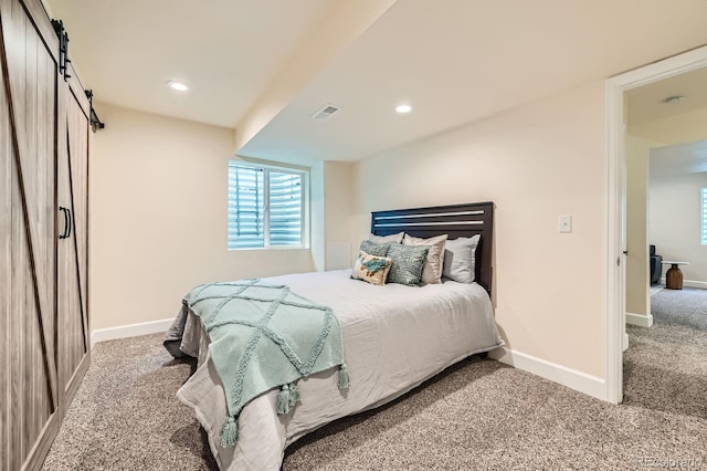 2150 Wagon Way, Louisville, CO 80027 - carpeted bedroom featuring baseboards, multiple windows, a barn door, and recessed lighting