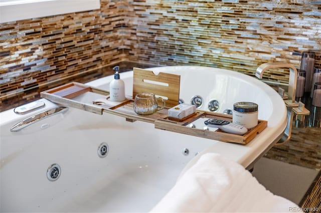 222 S Olive St, Denver, CO 80230 - full bathroom with backsplash and a whirlpool tub