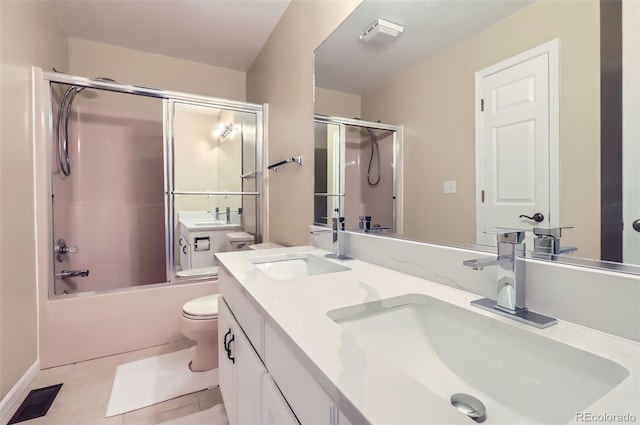 full bath featuring toilet, double vanity, and shower / bath combination with glass door