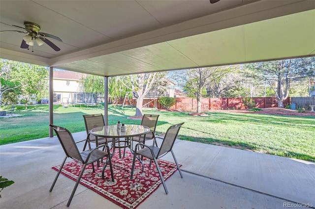 view of patio / terrace featuring ceiling fan, outdoor dining area, and a trampoline
