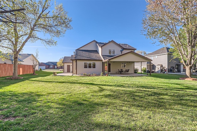 rear view of property featuring a patio area