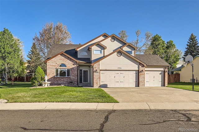 traditional-style home with brick siding, an attached garage, and concrete driveway