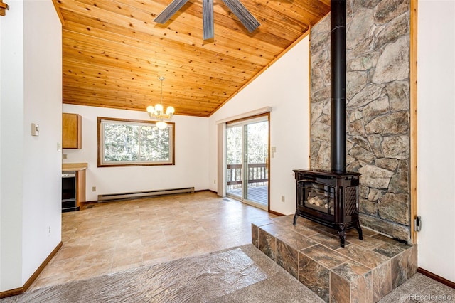 unfurnished living room with baseboard heating, ceiling fan with notable chandelier, a wood stove, and wooden ceiling