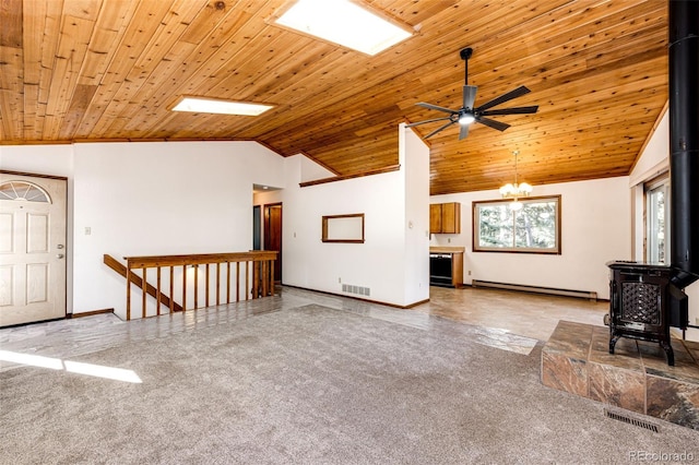 unfurnished living room featuring vaulted ceiling, wooden ceiling, baseboard heating, a wood stove, and ceiling fan with notable chandelier