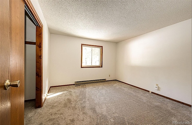 unfurnished bedroom featuring a baseboard radiator, a textured ceiling, and carpet