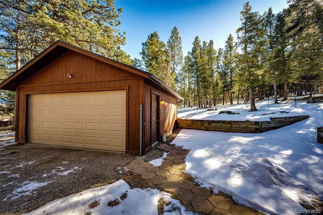 view of snow covered garage