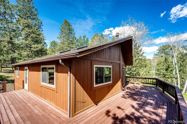224 Yellow Pine Dr, Bailey, CO 80421 - wooden terrace with view of scattered trees