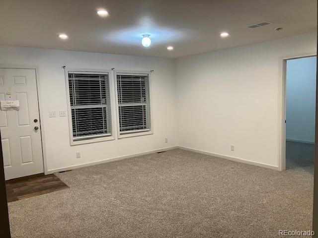 unfurnished room with carpet flooring