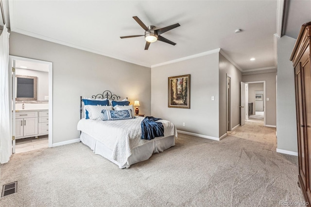 bedroom featuring visible vents, baseboards, ornamental molding, light carpet, and ensuite bath