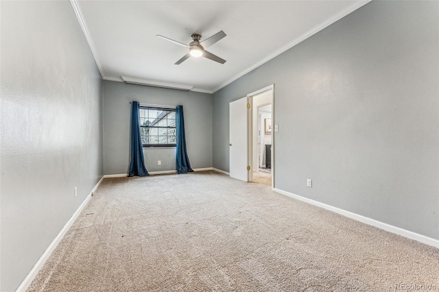 interior space with light carpet, a ceiling fan, crown molding, and baseboards