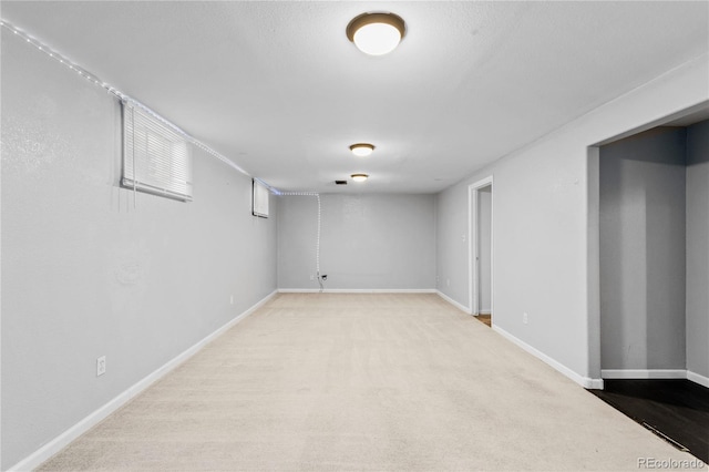 basement with light carpet