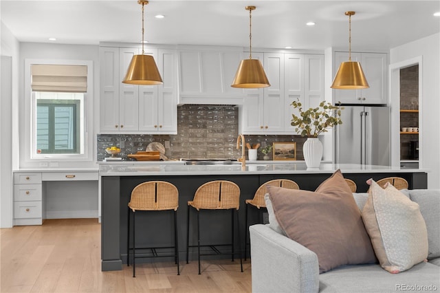 3256 S Corona, Englewood, CO 80113 - kitchen featuring freestanding refrigerator, decorative backsplash, light wood finished floors, and recessed lighting