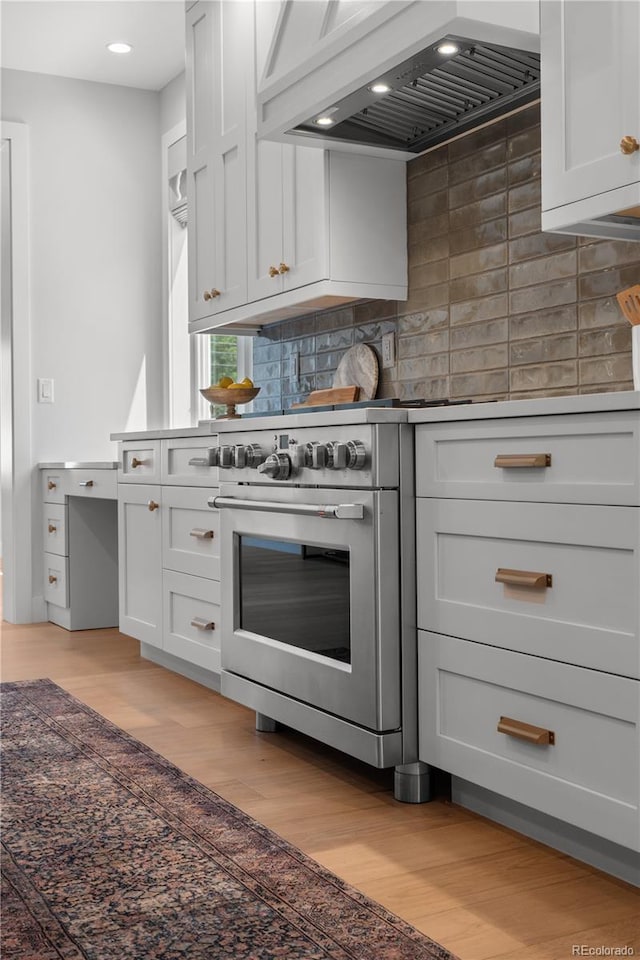 3256 S Corona, Englewood, CO 80113 - kitchen with custom exhaust hood, tasteful backsplash, light wood-style floors, and recessed lighting