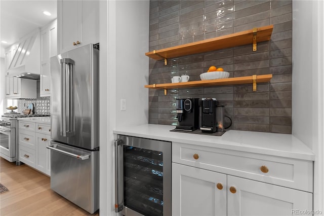 3256 S Corona, Englewood, CO 80113 - indoor dry bar featuring high quality appliances, beverage cooler, tasteful backsplash, light wood-type flooring, and recessed lighting