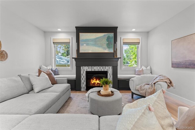3256 S Corona, Englewood, CO 80113 - living room featuring light wood-type flooring, a warm lit fireplace, recessed lighting, and baseboards