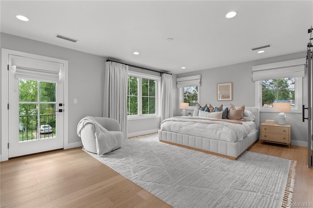 3256 S Corona, Englewood, CO 80113 - bedroom featuring multiple windows, light wood-type flooring, access to outside, recessed lighting, and baseboards