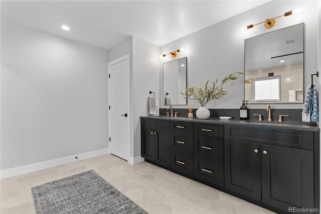 3256 S Corona, Englewood, CO 80113 - full bathroom featuring double vanity, tile patterned flooring, recessed lighting, and baseboards