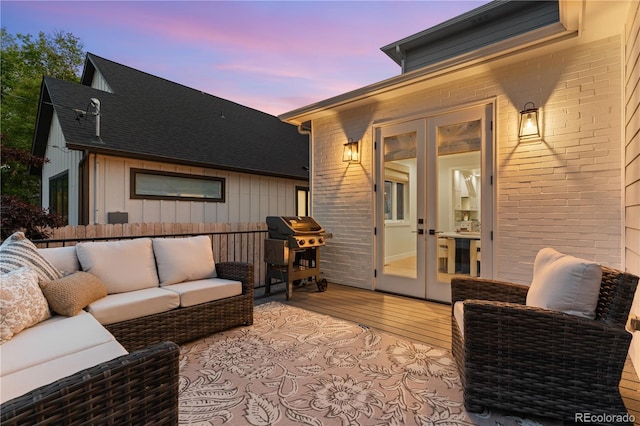 3256 S Corona, Englewood, CO 80113 - deck at dusk featuring french doors, an outdoor living space, and a grill