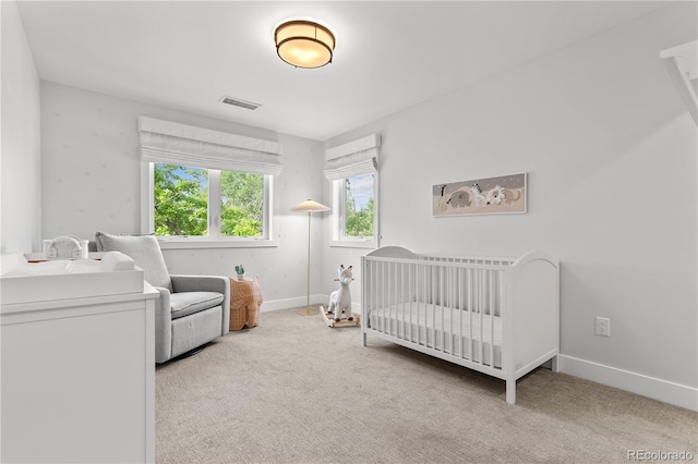 3256 S Corona, Englewood, CO 80113 - carpeted bedroom with a nursery area and baseboards