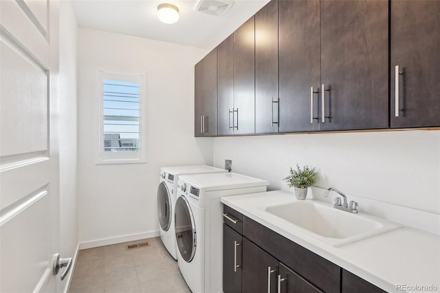 13960 Box Turtle Loop, Parker, CO 80134 - clothes washing area with visible vents, washer and dryer, baseboards, a sink, and cabinet space