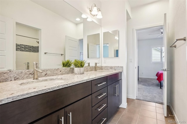 13960 Box Turtle Loop, Parker, CO 80134 - full bathroom featuring double vanity, a sink, baseboards, and tile patterned flooring