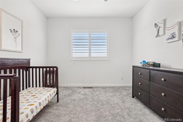 13960 Box Turtle Loop, Parker, CO 80134 - carpeted bedroom with visible vents, a crib, and baseboards