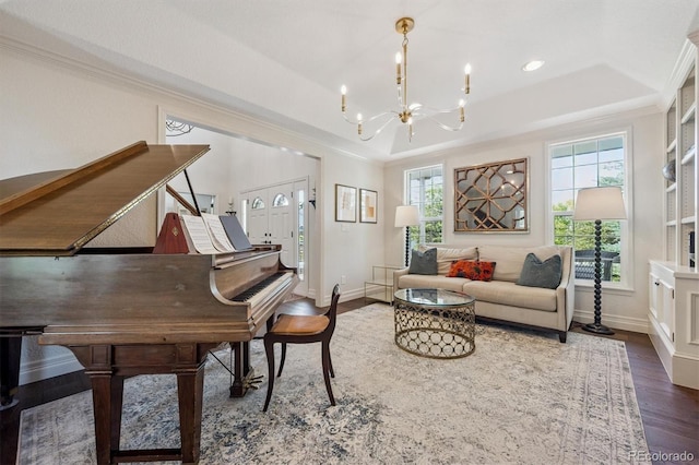 10660 Weathersfield Ct, Highlands Ranch, CO 80129 - sitting room with a raised ceiling, dark wood-style floors, a chandelier, crown molding, and recessed lighting