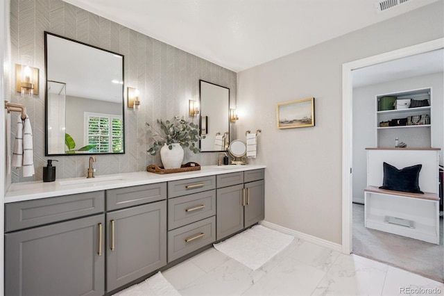 10660 Weathersfield Ct, Highlands Ranch, CO 80129 - full bath featuring double vanity, wallpapered walls, and marble finish floors