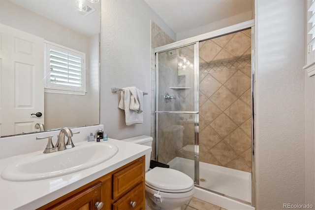 10660 Weathersfield Ct, Highlands Ranch, CO 80129 - bathroom featuring a textured wall, a stall shower, and vanity